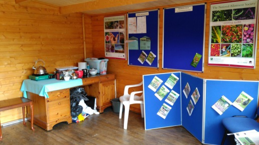 Photo of inside of cabin, showing display boards and seeds
