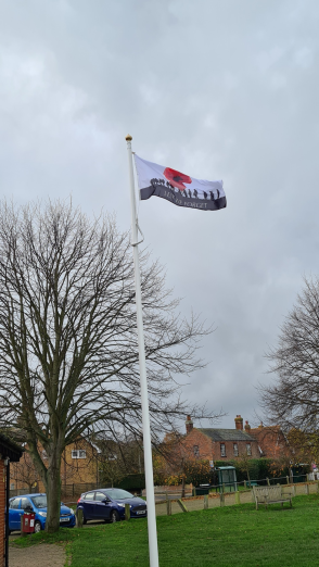 picture of Lest we forget flag flying on pole